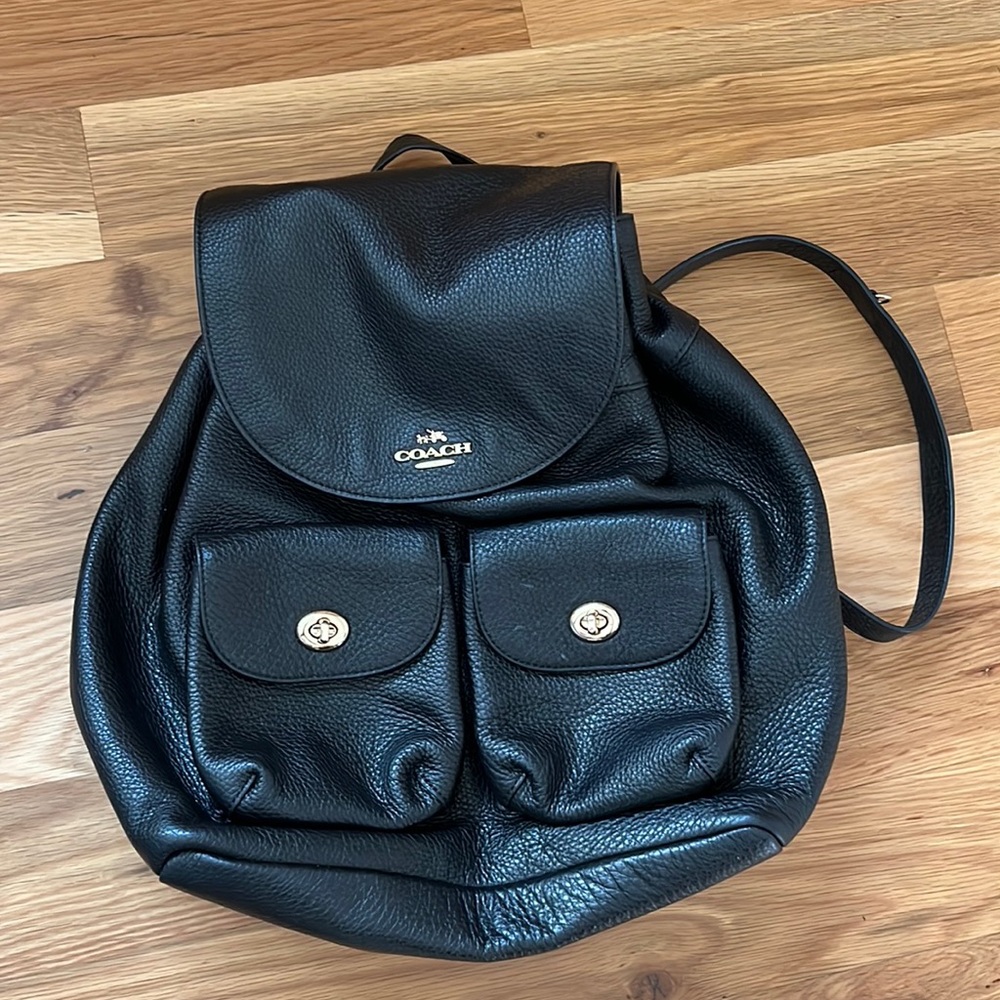 Coach black and gold turnlock pebble leather backpack